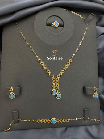 طقم فيروزي 21k