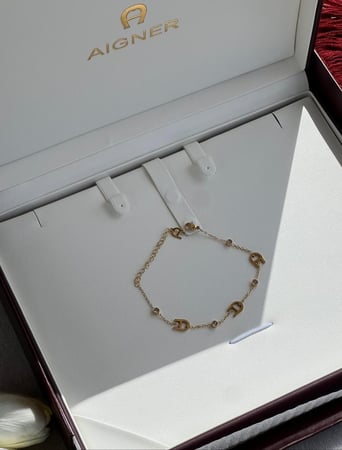 إسوارة AIGNER ذهبي