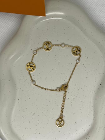 إسوارة LOUIS VUITTON معدن ذهبي صدفي