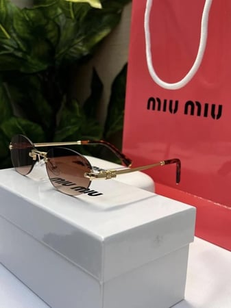 نظارة miu miu أطار ذهبي تايقر عدسة بني