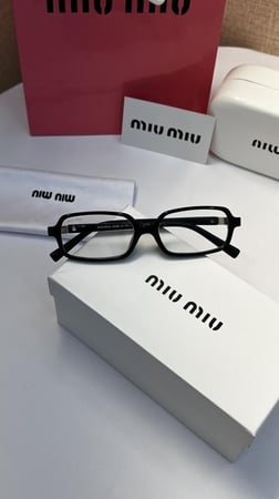 نظارة miu miu أطار أسود - عدسة شفافة