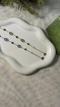 اسوارة GUCCI ذهبي - فضي