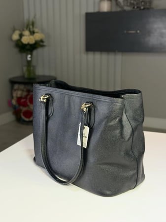 كوتش كيت جلد بالكامل كاريل