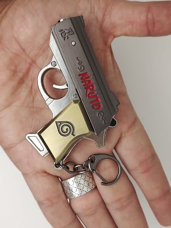 ميدالية مسدس خرز حديد