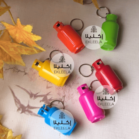 ميداليات على شكل انبوب غاز / توزيعات الدفاع المدني ( 12 قطعه )