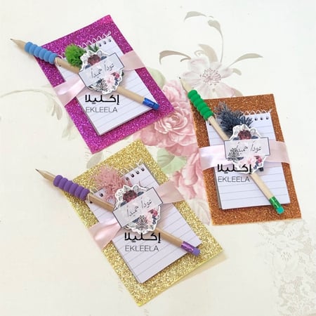 توزيعات العوده للمدرسه  / توزيعات نوته مع قلم رصاص ( 12 قطعه )