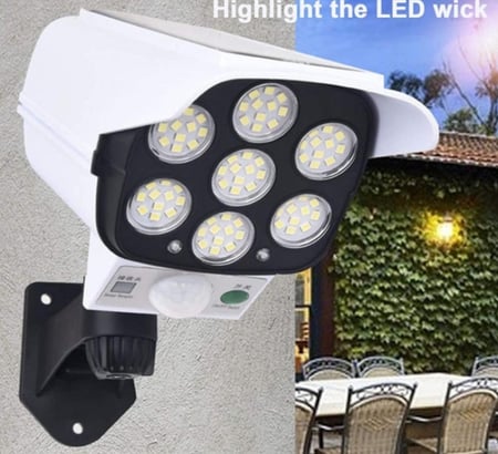 مصباح جداري يعمل على الطاقة الشمسية على شكل كاميرا وهمية