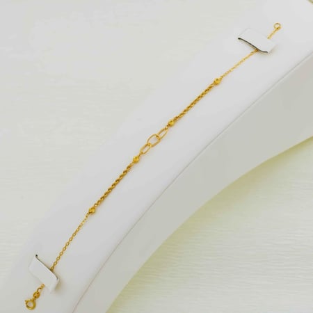 أساور ذهب صافي عيار 21 ، الوزن ( 1.40 ) جرام تقريباً