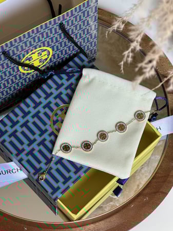 إسوارة TORY BURCH معدن ذهبي
