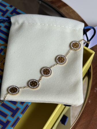إسوارة TORY BURCH معدن ذهبي