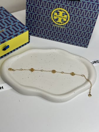 إسوارة TORY BURCH معدن ذهبي