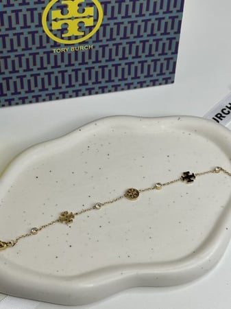 إسوارة TORY BURCH معدن ذهبي