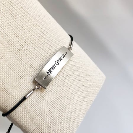 اسورة never grow up  فضي