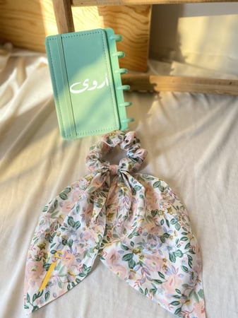 توزيعات ربطة مع دفتر بالاسم