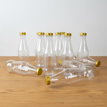 مجموعة قوارير بلاستيك شفافة (12 حبه) للعصائر والمشروبات الباردة غطاء ذهبي وفضي