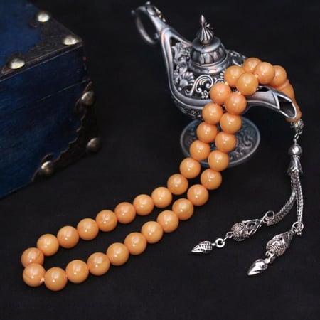 سبحة مسكي عسلي هادئة بحبات دائرية وشرابة مميزة