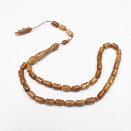 سبحة كوك طبيعي بحبات صغيرة أسطوانية وشرابة سيستملي