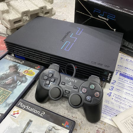بلايستيشن 2 فات مع مجموعة العاب.(Playstation 2).