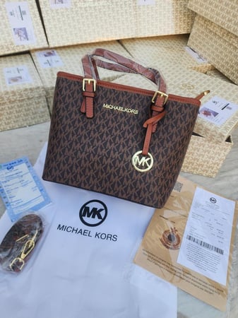 مايكل كورس ماستر طبق الاصل