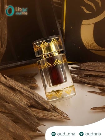 Old Indian Kalakasi Agarwood Oil with agarwood in background