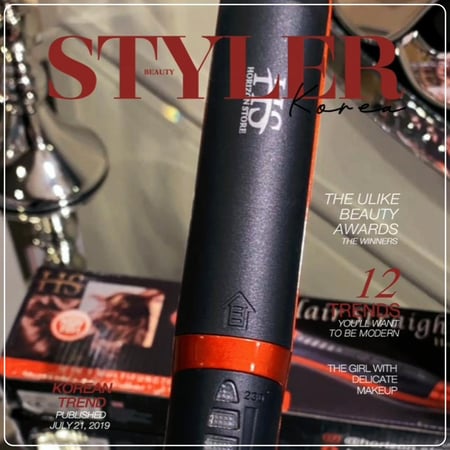 صورة مقربة المشط المطور مملس شعر أسود وبرتقالي