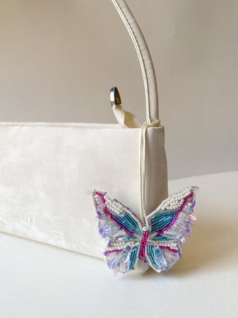 Luminous Flutter Charm