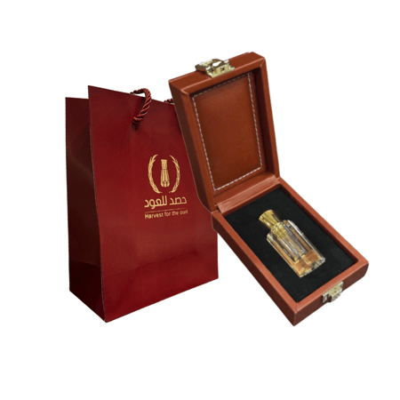 كرستالة دهن عود بشعار قطر مع كيس إهداء