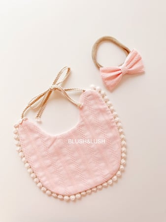 Bib with tassel
