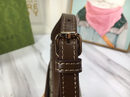 شنطة قوتشي بني