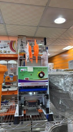 ماكينة تغليف الاكواب يدوية