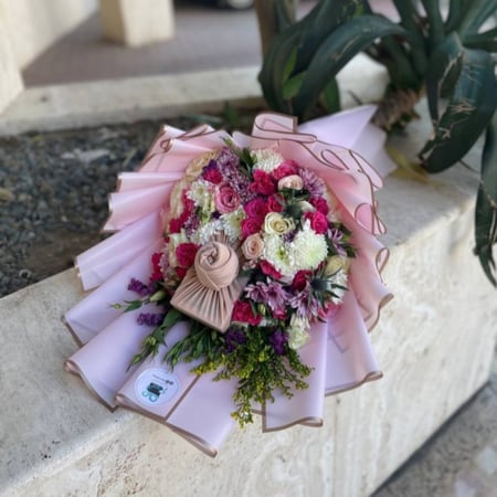 تنسيق الهدية بباقة ورد