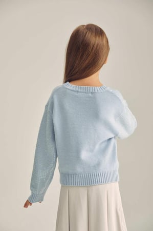 كنزة مزينة بالترتر اللامع