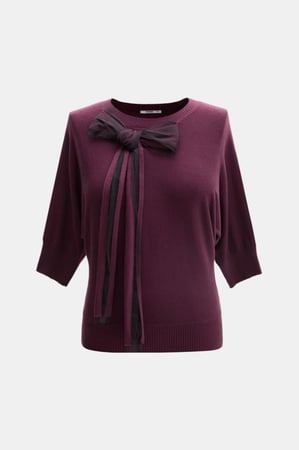 بلوزة محبوكة بفيونكة تول