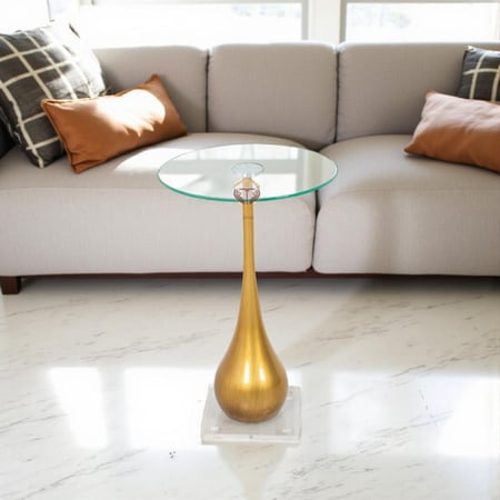 طاولة خدمة مودرن قاعدة لون ذهبي وسطح زجاج شفاف