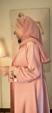 # 381 عباية وردية مع تطريز يدوي ( متوفر أسود )