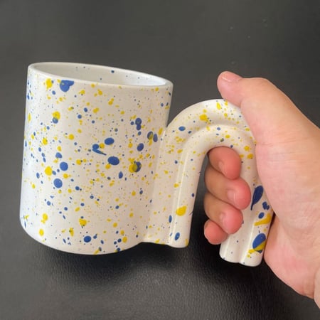 كوب سيراميك بتصميم مقبض الباب