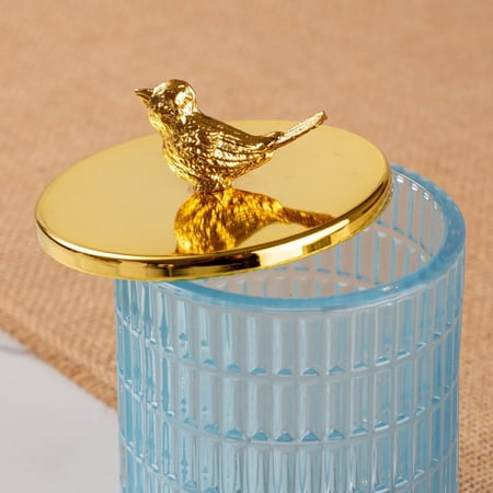 علبة زجاج بغطاء ذهبي