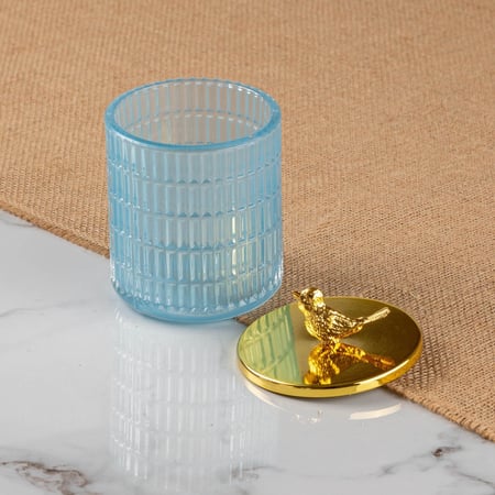 علبة زجاج بغطاء ذهبي