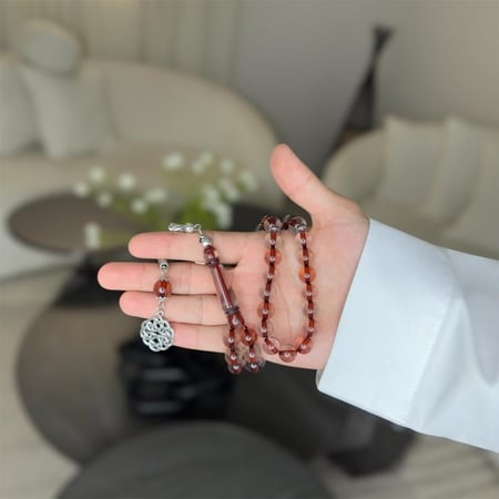 مسباح بكلايت ( عنابي شفاف )