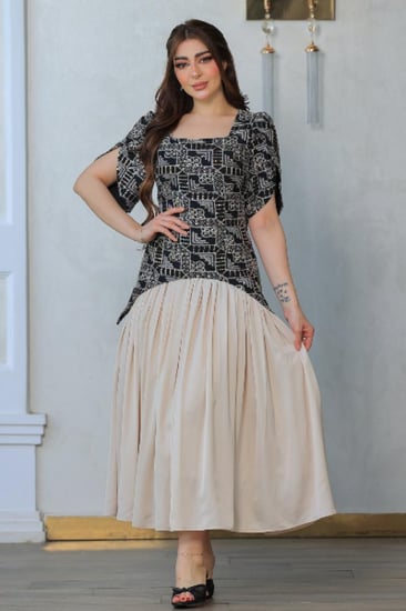 فستان أنيق يجمع بين الطابع الكلاسيكي واللمسة العصرية