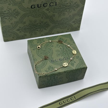 سوارة قوتشي ستيل ذهبي