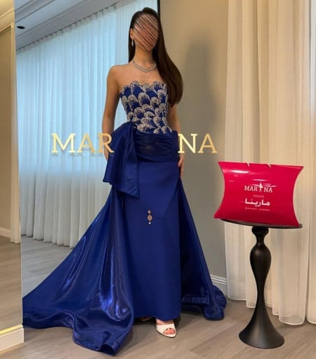 فستان جودي النيلي  ( نيلي صدريه شك سهره وباربي وذيل جزار لمعه )