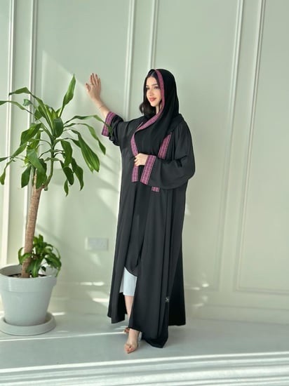 Pink with black abaya