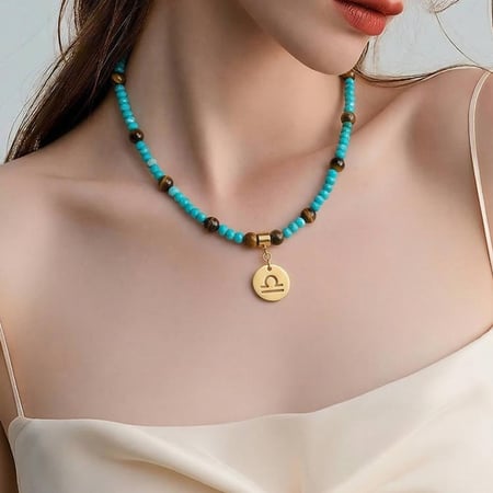 قلادة الفيروز وعين النمر مع تعليقة البرج – طاقة الحماية والقوة