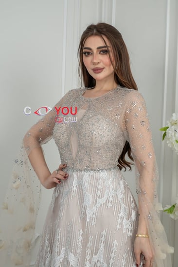 فستان سهرة بيج فاخر بتطريز لامع وطبقة تول أنيقة