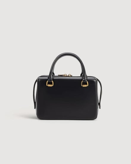 شنطة نسائية بتصميم أنيق بلون أسود