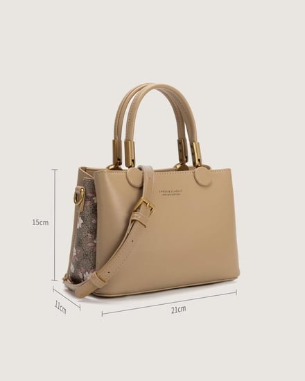 شنطة نسائية من الجلد باللون البني