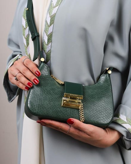 شنطة مِسك النسائية جلد بلون أخضر