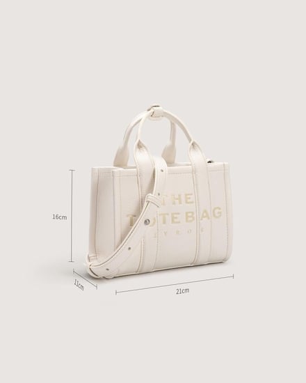 شنطة نسائية بتصميم عصري بلون أبيض