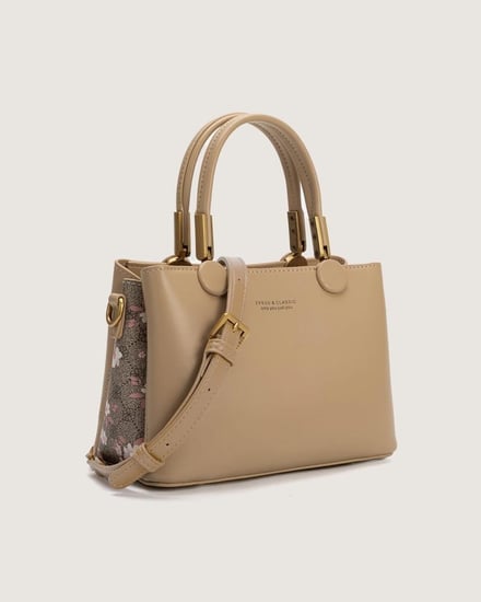 شنطة نسائية من الجلد باللون البني